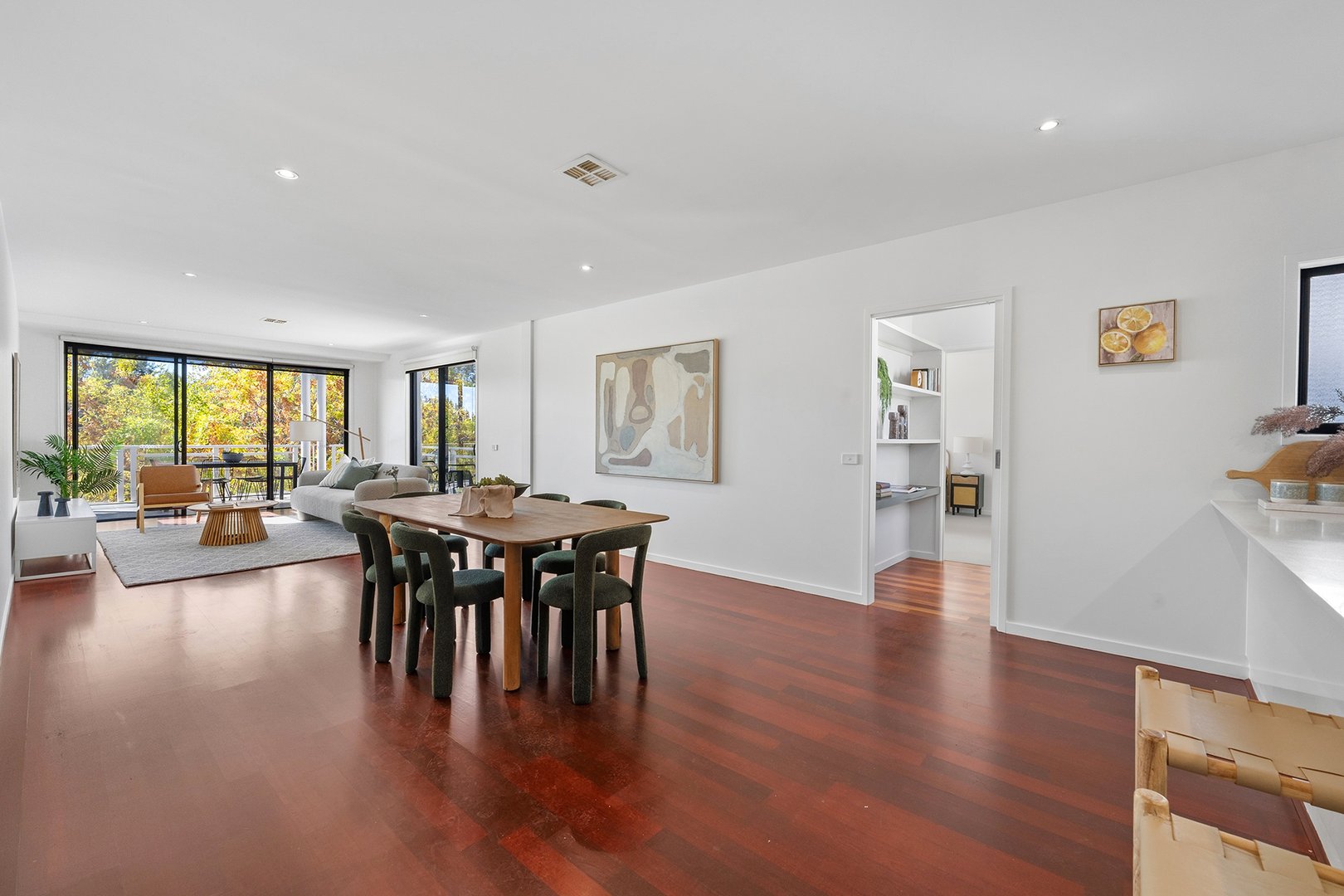 Open-plan living and dining with timber floors