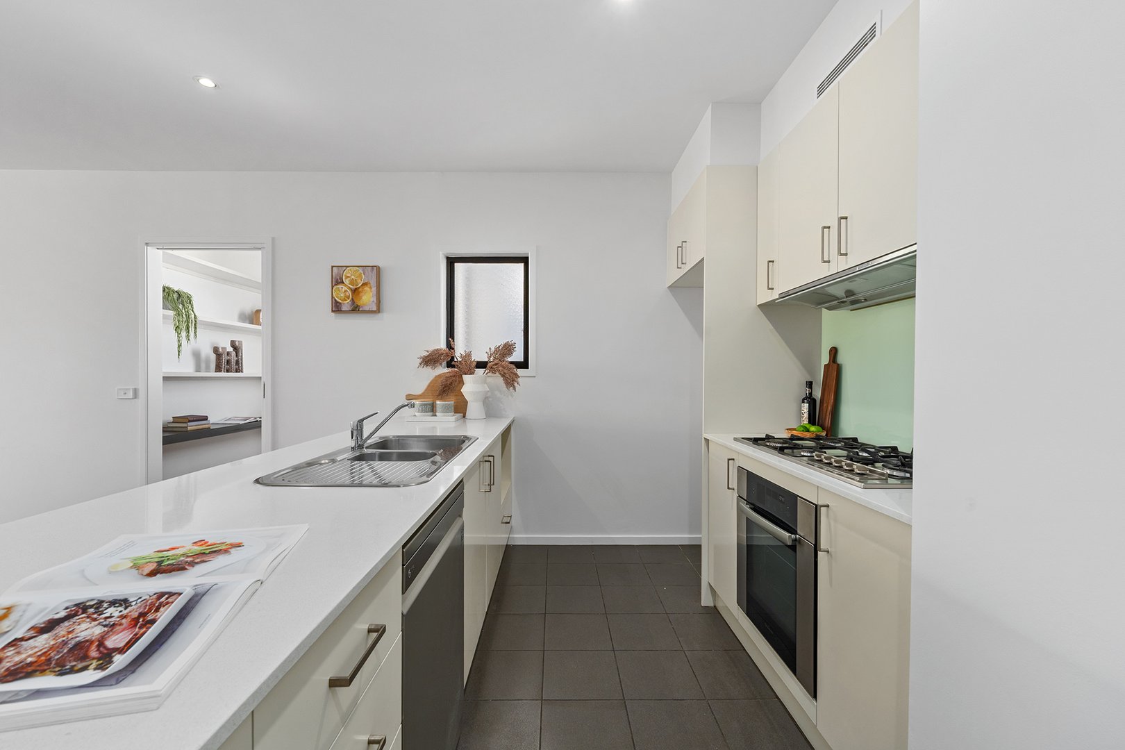 Galley kitchen with stainless steel appliances