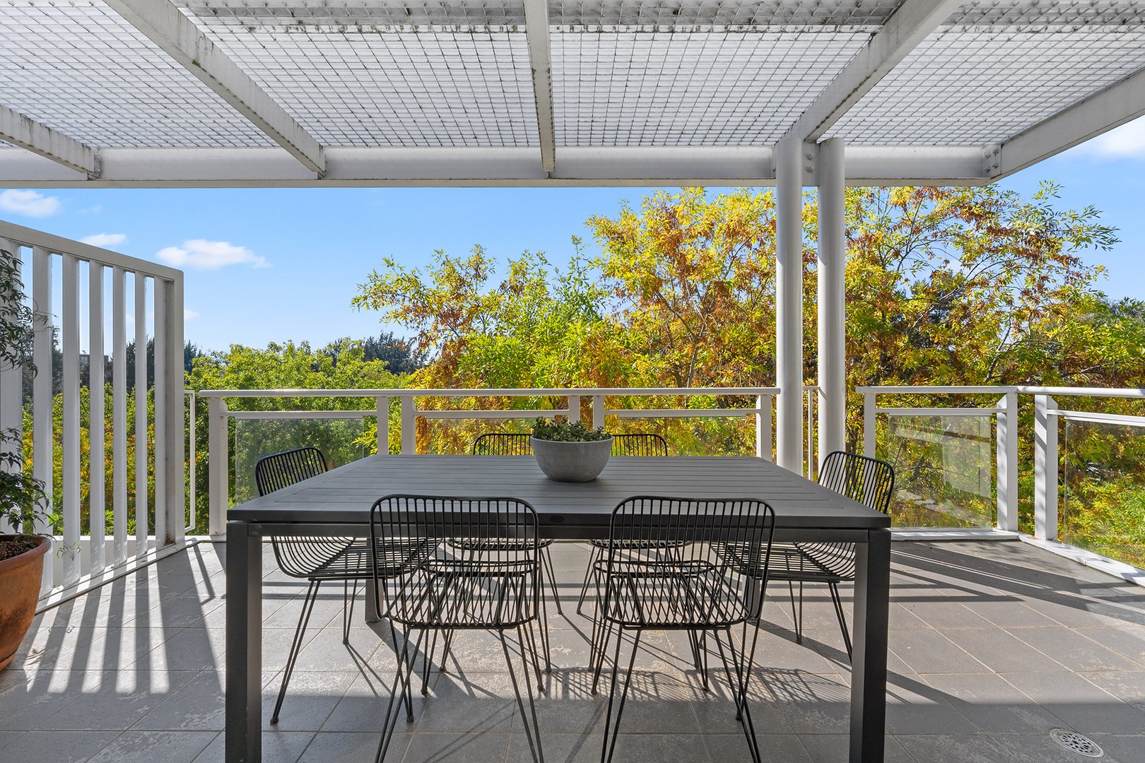 Covered balcony with outdoor dining