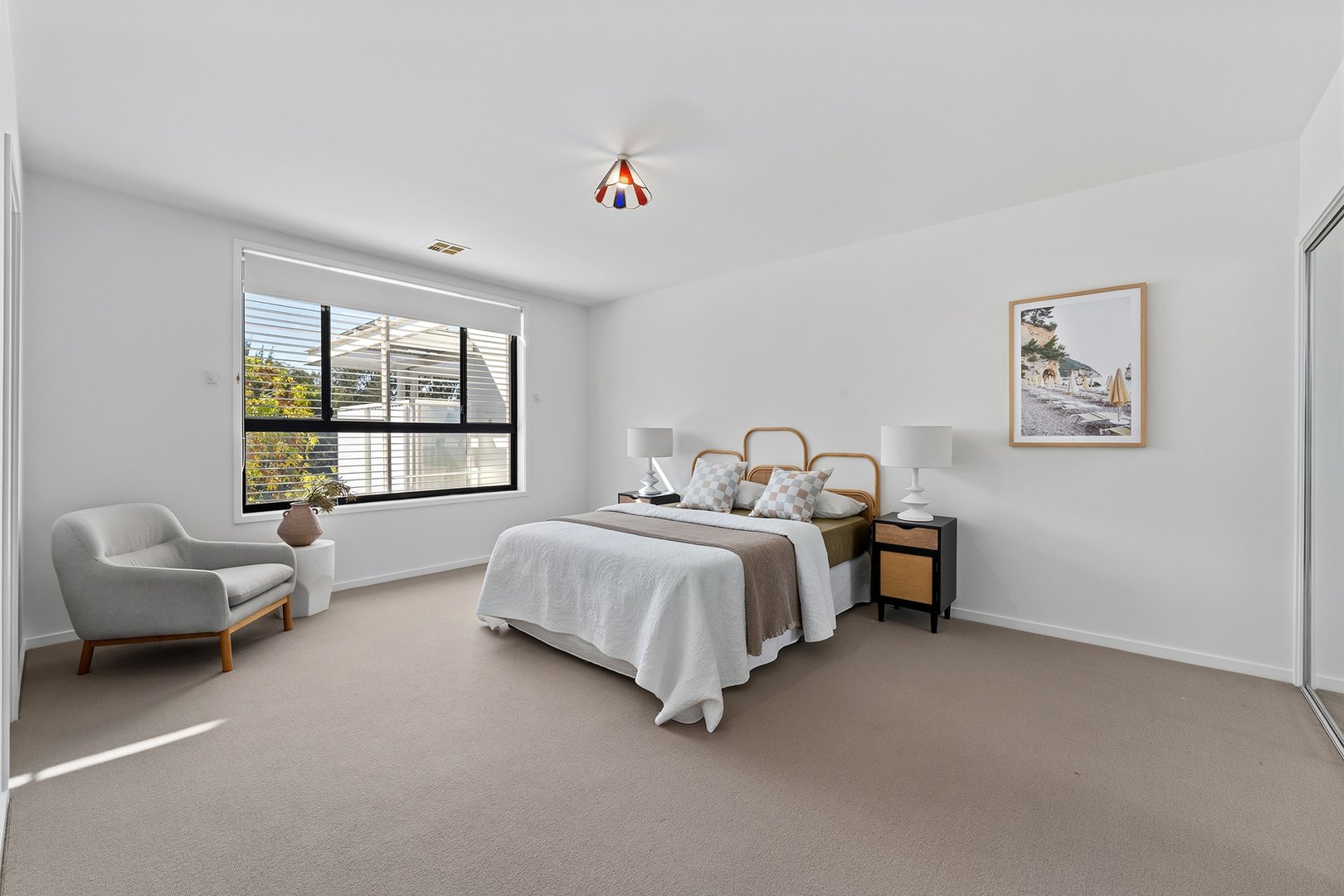 Spacious main bedroom with leafy outlook